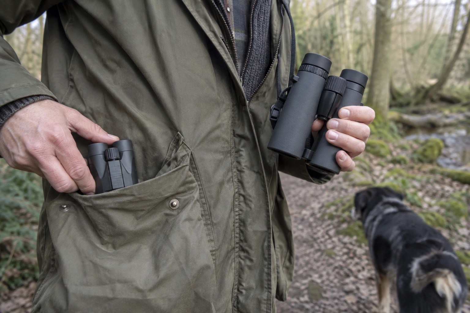 Tiny pocket binocular beside a larger unbranded 32mm binocular on a woodland walk